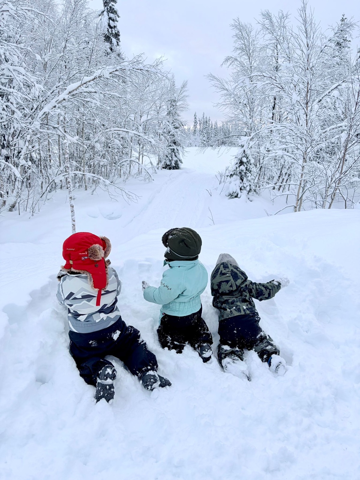 Children playing in the snow at Lakita Lodge in Swedish Lapland
